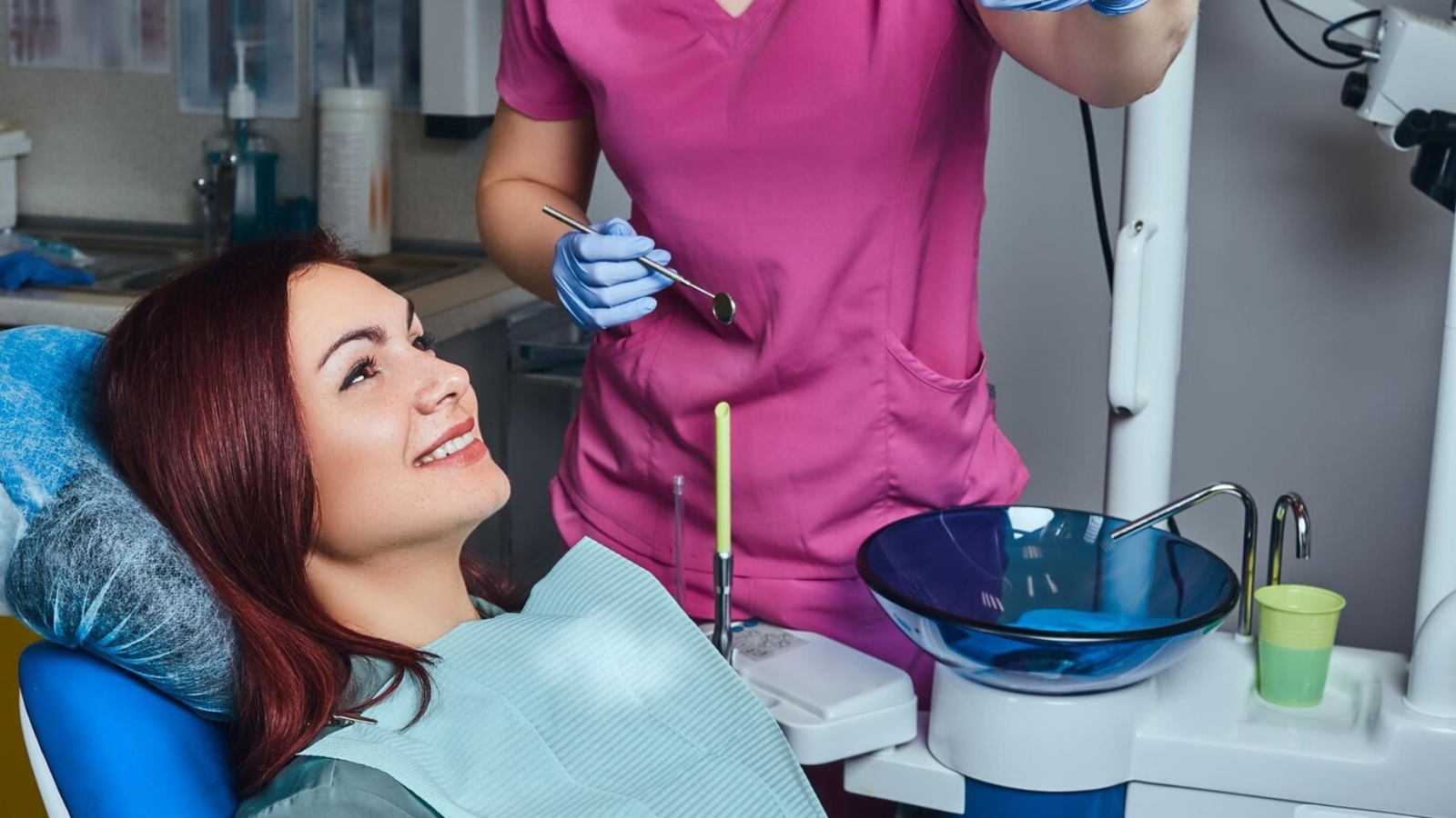 young-redhead-woman-having-examination-while-sitting-dental-chair-clinic_613910-17749